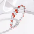 Elegant titanium steel bracelet featuring red and white square-cut zircons, open spring design. - Colorful