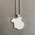 Close-up of a polished stainless steel necklace with a unique onesie-shaped pendant - Necklace Set / Steel