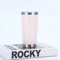 Light pink 20oz stainless steel vacuum insulated tumbler displayed on a white book - 20oz / White