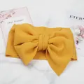 Detailed macro view of yellow bubble texture baby bow headband for photography - Yellow