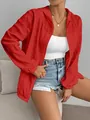 Close-up detail of a women's red textured hooded sun protection jacket with front zipper - Red