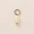 Minimalist baroque pearl charm pendant with a twisted silver metal ring on beige backdrop - White Pearl Pendant