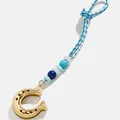 Elegant gold horseshoe charm with blue and white braided rope and decorative beads - Horsebit Buckle