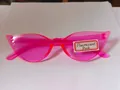 Vibrant neon pink cat-eye sunglasses with translucent frames for stylish SKU display - Fluorescent Pink