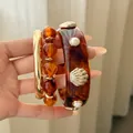 Stylish tortoiseshell resin cuff and gold bangle set with pearl and seashell accents - #3 Bracelet - Gold - Brown (three-piece Set)
