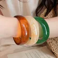 Set of retro resin bangles in amber, cream, and emerald green finishes. - 10# Bracelet - White - Black - Pink (three-piece Set)