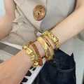 Metallic gold-tone irregular bangle set with amber beads for trendy women's wristwear - 31# Bracelet - Gold (four-piece Set)
