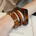 Set of 4 stylish amber resin bracelets with gold-tone spacers for a retro chic look - 34# Bracelet - Brown (three-piece Set)