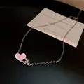 Elegant silver necklace with heart pendant and sparkling zircon accents - Silver