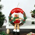 Handcrafted Christmas gingerbread man wreath featuring a red Merry Christmas sign - Gingerbread Man Red Hat Wreath