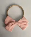 Fascia elastica in nylon per neonati con un dettaglio decorativo a fiocco in tessuto di lino rosa - 62