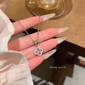 Silver flower pendant necklace with central clear gem shown in close-up detail view - Flower Main Diamond Clavicle Necklace (X2211) / Silver