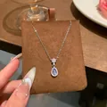 Close-up of a elegant teardrop blue stone pendant on a silver titanium steel necklace - Blue Main Stone Teardrop Shape Clavicle Chain (X2159) / Silver