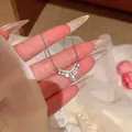 Detail of silver titanium steel necklace with V-shaped crystal pendant and pearl. - V Shape Rhinestone Artificial Pearl Pendant (X2239) / Silver