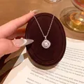 Elegant silver-toned titanium steel necklace with a pearl pendant on a velvet stand - Artificial Pearl Surrounded by Double Layer Rhinestone Pendant (X2157) / Silver