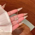 Elegant silver bow necklace featuring a sparkling water drop crystal pendant for women - Bow Teardrop Shape Crystal Clavicle Necklace (X2163) / Silver