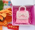 Charming pink glitter mini handbag for girls featuring a pearl handle and bow - Pink With Pearl Bow