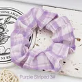 Purple and white plaid fabric scrunchie with a soft ruffled texture shown in detail view. - Purple Stripes 3