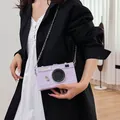 Detailed view of a stylish vintage camera-shaped hard box crossbody bag in textured purple - 10 / Purple