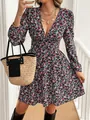 Detailed view of long sleeve ditsy floral mini dress with V-neckline and straw bag - S / Tops / Floral Pattern
