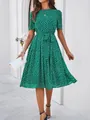 Detailed view of green polka dot dress showing tie waist and short sleeve style - S / Tops / Green