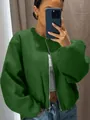 Close-up detail of a soft green zip-up bomber jacket worn by a model in a mirror selfie - XXS / Tops / Green