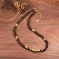 Detail view of natural coconut shell and copper alloy beaded necklace with golden spacers - Gold Style (3)