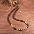 Macro view of retro necklace made with natural coconut shell and gold copper alloy - Gold Style (4)