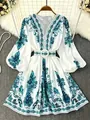 Detailed view of bohemian print dress with V-neckline and elegant lantern sleeves. - S / Top And Bottom / Teal