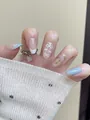 Detailed view of short oval press-on nails with delicate floral and bow designs. - By2156 / Full Sizes (M/S/XS)#30 Pieces/Plate