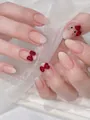 Nude pearlescent press-on nails with red bow and kitty character accents - By2044 / Handmade Nail Art Size M 10 Pieces/bag [tool Kit Included]