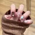 Short oval press-on nails in nude with Hello Kitty and leopard print designs - By2456 / Handmade Nail Art Size M 10 Pieces/bag [tool Kit Included]