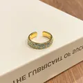 Close-up of retro gradient blue floral pattern on golden open ring band. - Style 2 Four-Petal Pattern