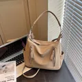 Textured beige hobo crossbody bag for women, perfect for commuting and students. - Khaki