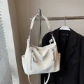 Stylish white hobo shoulder bag with front zipper pockets and adjustable crossbody strap - Off White