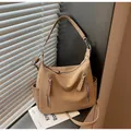 Stylish tan textured leather hobo crossbody bag for women with decorative front zippers - Khaki