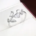 Detailed macro view of an elegant silver branch leaf ring set with sparkling stones - Size 6 / Silver + White (50838) / Silver & White