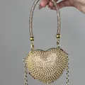 Sac à main de soirée luxueux en forme de cœur avec des strass champagne et une chaîne dorée. - A156 doré