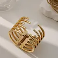 Elegante brazalete de aleación dorada con diseño irregular de varias filas y resorte - Estilo de Apertura de Anillo Irregular (As0025)