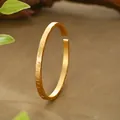Close-up of an ancient style sand gold bangle with traditional Chinese etchings - Open Carved Pattern Style (SZ00219) / Adjustable Open / Gold