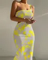 Elegant white one-shoulder bodycon midi dress with vibrant yellow floral prints. - S / Bottoms / Bright Yellow
