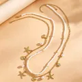 Goldene Boho-Taillenkette mit weißen Perlen, Seestern- und Muschelanhängern. - 78 KC-Gold Ozean Urlaub Perle (A-370)