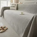 Funda de sofá gris con patrón de espiga mostrada en una acogedora sala de estar - 180*150 / Gris claro