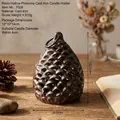 Vintage pinecone cast iron candle holder for rustic home decor and photography props. - Cast Iron Pine Cone Candle Holder 7028