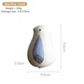 Small Nordic ceramic bird figurine in white with blue feather patterns for home decor - S / Blue