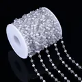 Macro view of 4mm white pearl and crystal bead chain for DIY jewelry making - Silver
