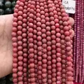 Detailed macro view of 8mm natural pink rhodonite round stone beads showing unique texture - Grade A Zoisite/roseite / 8mm