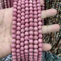Macro view of 8mm pink rhodonite zoisite round natural stone loose beads for jewelry crafts - Grade A Mahogany Grain/rose Quartz / 8mm