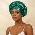 Shiny emerald green metallic turban headwrap featuring elegant front cross knot detail - Green