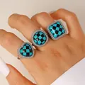 Detailed view of three rings with turquoise checkerboard patterns in various shapes - 3-Piece Vintage Rings